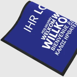Fussmatte Willkommen blau mehrsprachig mit Logo, 80x120cm